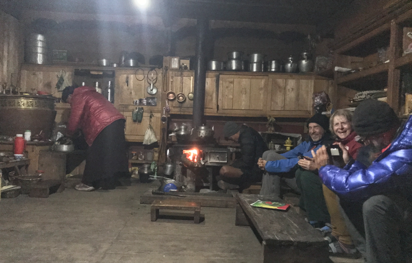 Tourist enjoying a laugh inside a cozy guest house in gumba lungdang. 